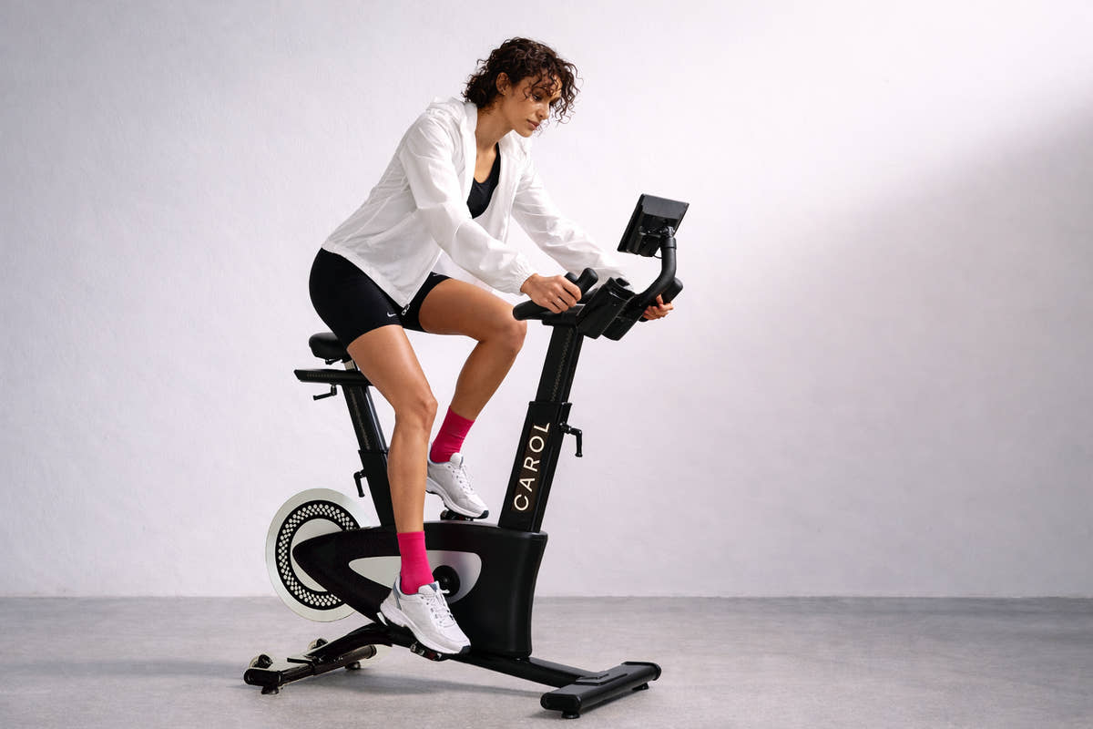 A woman resting after a stationary bike workout